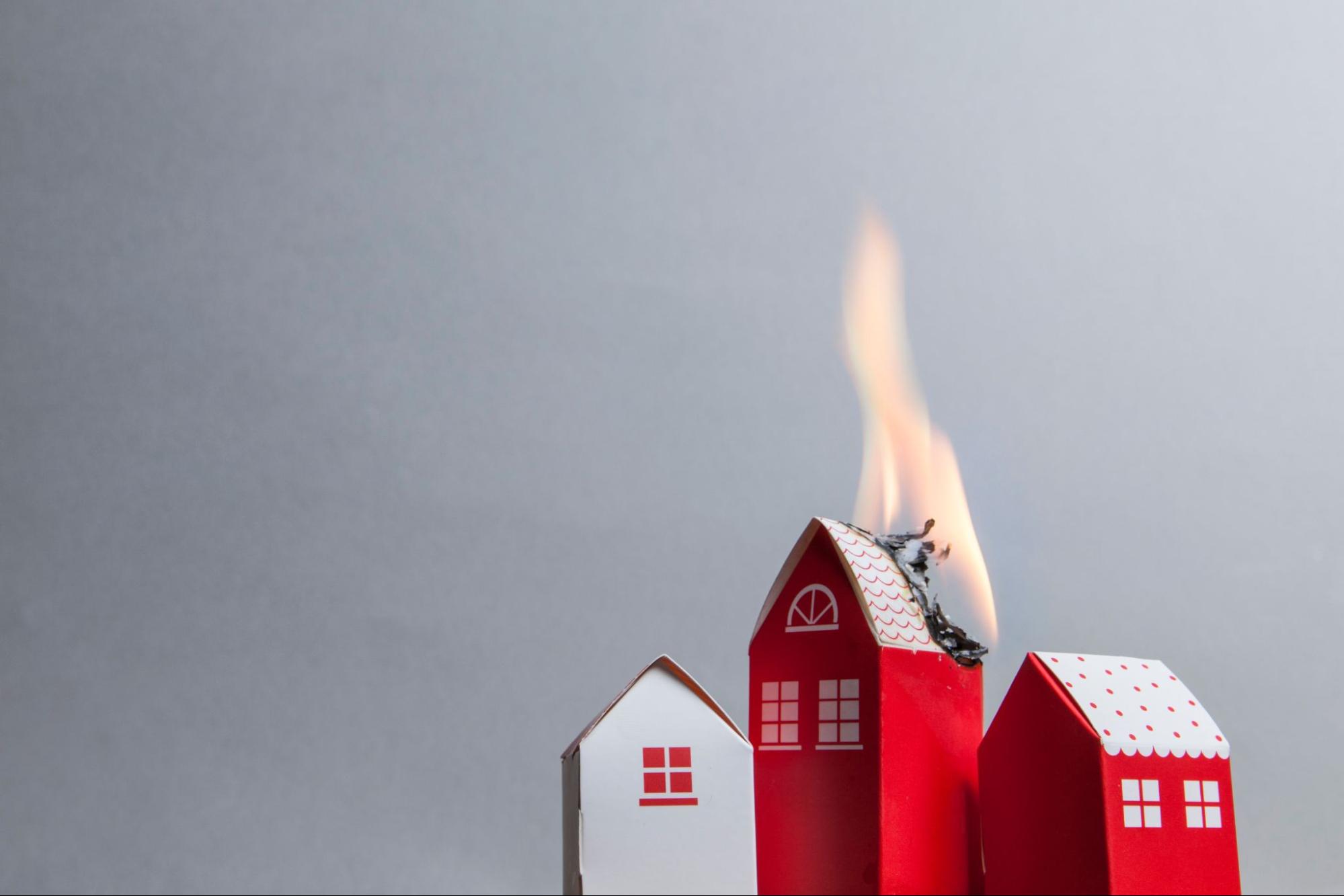 miniature house on fire