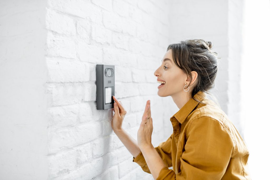 smart home security myrtle beach woman using a doorbell camera
