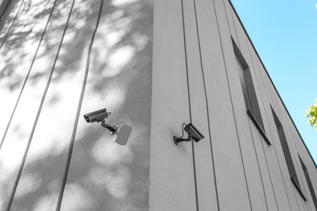 Security cameras installed on the exterior of homes