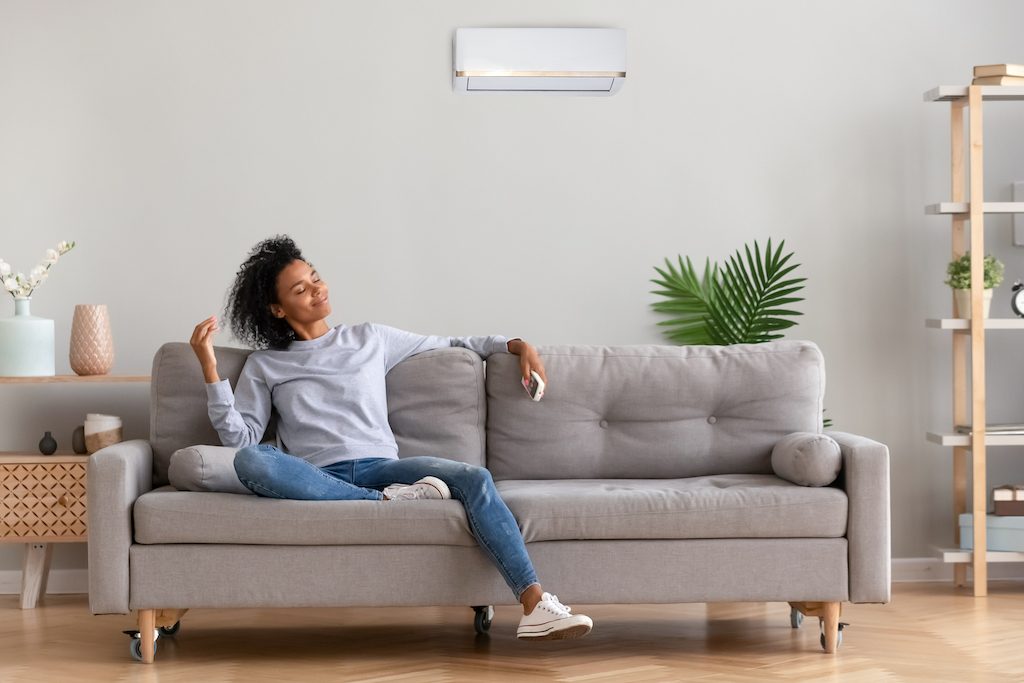 Women relaxing on the couch home alone